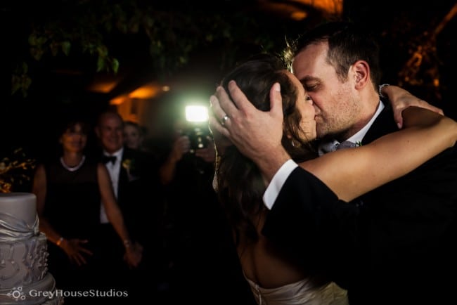 winvian wedding reception bride groom kissing after cutting cake photos