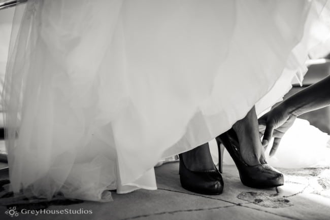 nyc east village wedding photos bride putting on shoes